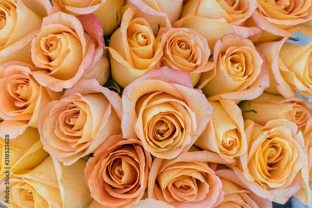Yellow orange roses picked fresh for sale at outdoor market in natural light Yellow orange roses picked fresh for sale at outdoor market in natural light