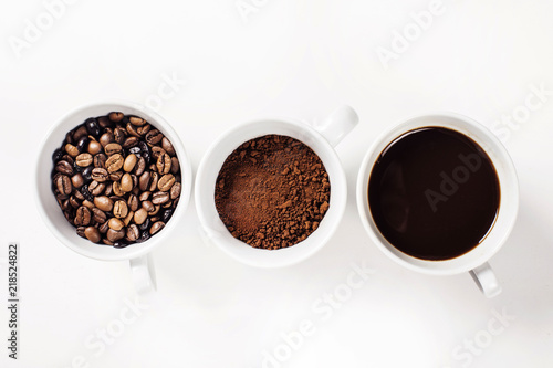 Many cups of coffee on white background