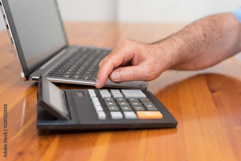 Man doing his accounting, financial adviser. Man doing his accounting, financial adviser.