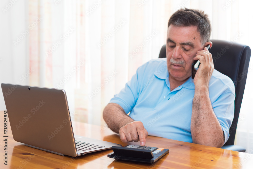 Man doing his accounting, financial adviser. Man doing his accounting, financial adviser.