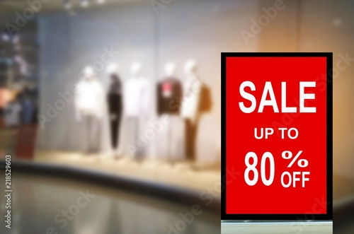 big sale 80% mock up advertise billboard or advertising light box with blurred image of popular fashion clothes shop showcase in department store, commercial, marketing and advertisement concept