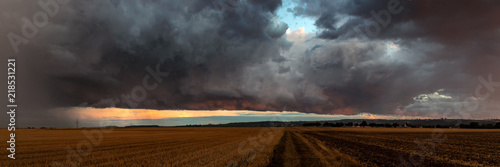 Dramatic thundercloud over a wheat field