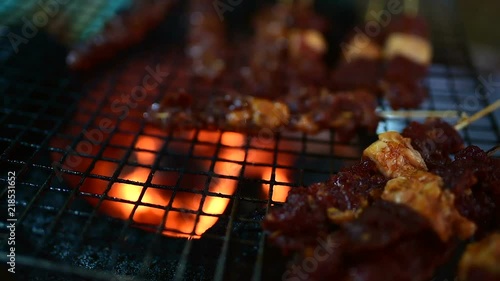 Local Cambodian woman preparing food on the street. This is one is a favorite meal for tourists. Roll with grilled sweet pork and cabbage. 