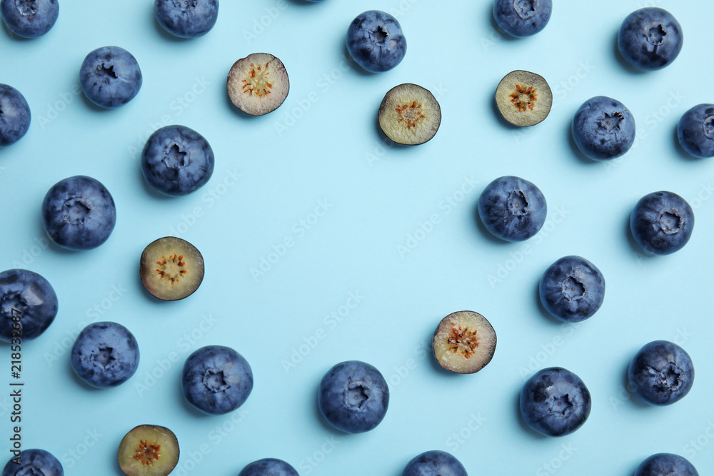 Flat lay composition with tasty blueberry and space for text on color background Flat lay composition with tasty blueberry and space for text on color background