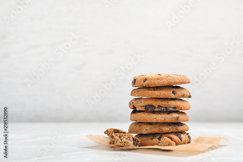 Stack of tasty chocolate cookies on light table