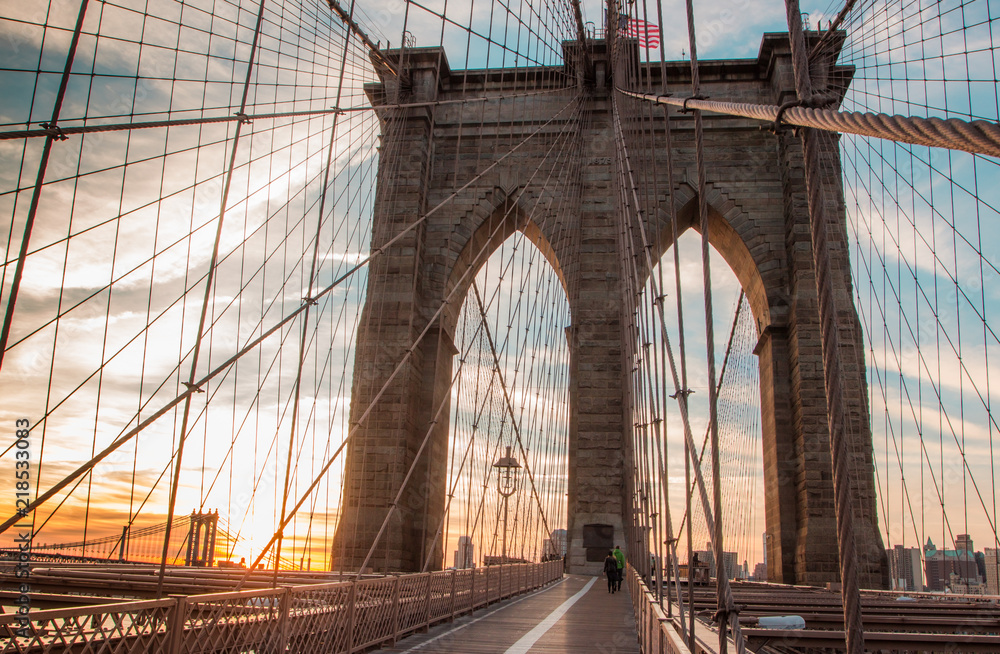 Naklejka premium Brooklyn Bridge on the sunrise in the morning lights, New York, New York state, USA