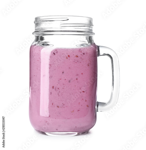 Mason jar with blackberry yogurt smoothie on white background