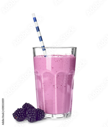 Glass with blackberry yogurt smoothie on white background