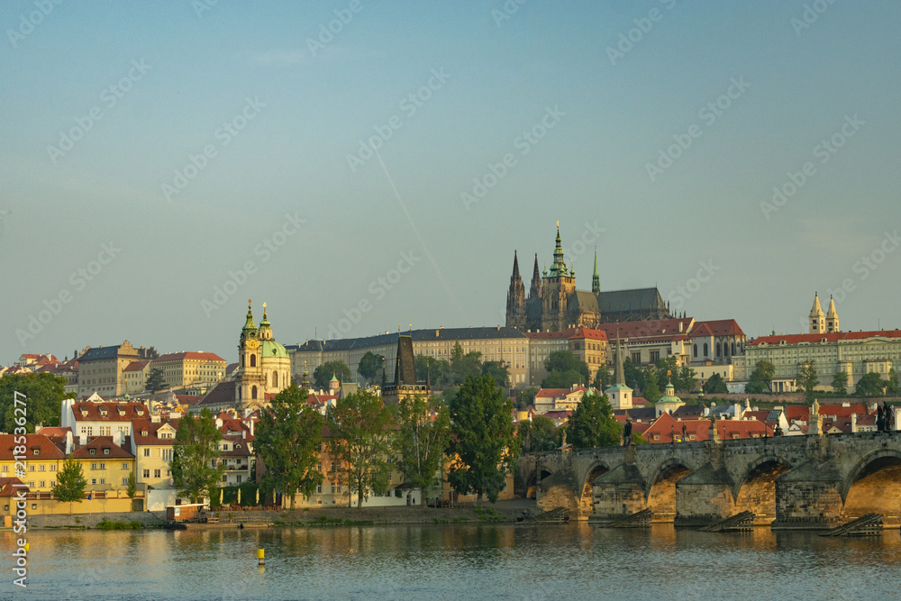 View of the panorama of the old historic center of Prague by the river and the Charles Bridge