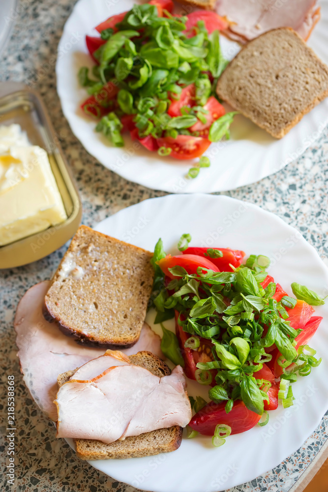 Tomatoes, scallions & basil salad with ham sandwiches and cheese Tomatoes, scallions & basil salad with ham sandwiches and cheese