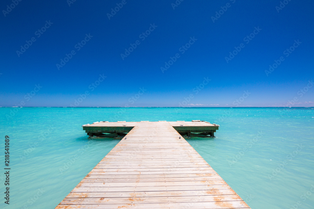 wooden Pier blue sky on background and caribbean sea wooden Pier blue sky on background and caribbean sea