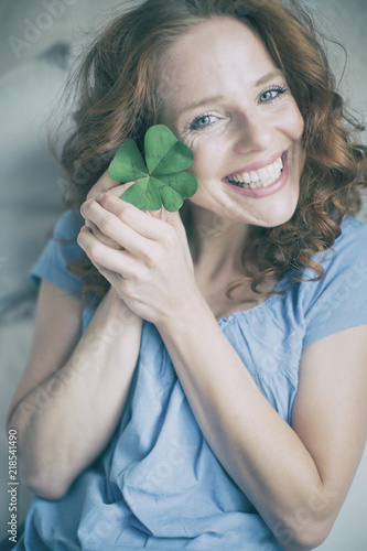 portrait of a young happy redhead woman photo