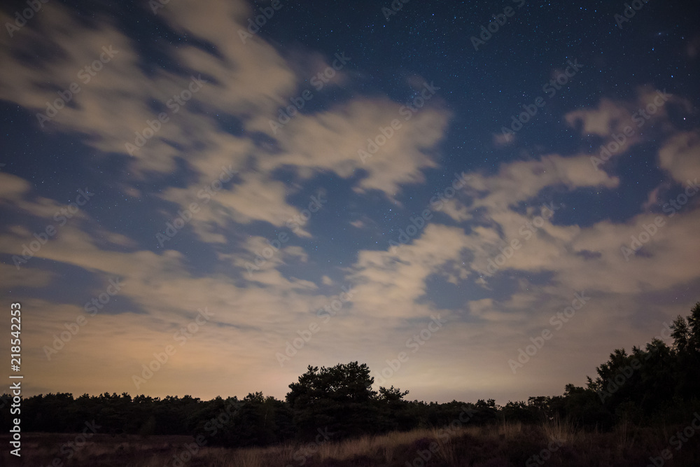 Cloudy nightsky in Maasduinen national park in the Netherlands