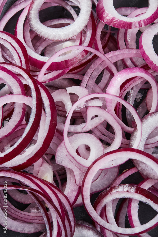Sliced red spanish onion rings backdrop