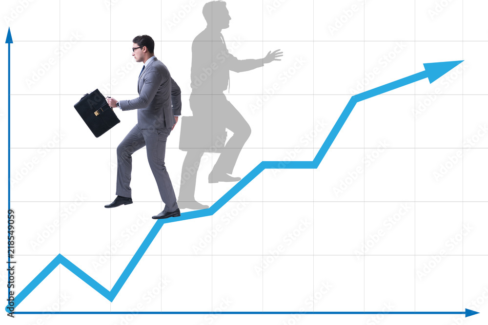 Businessman and his shadow in business concept Businessman and his shadow in business concept