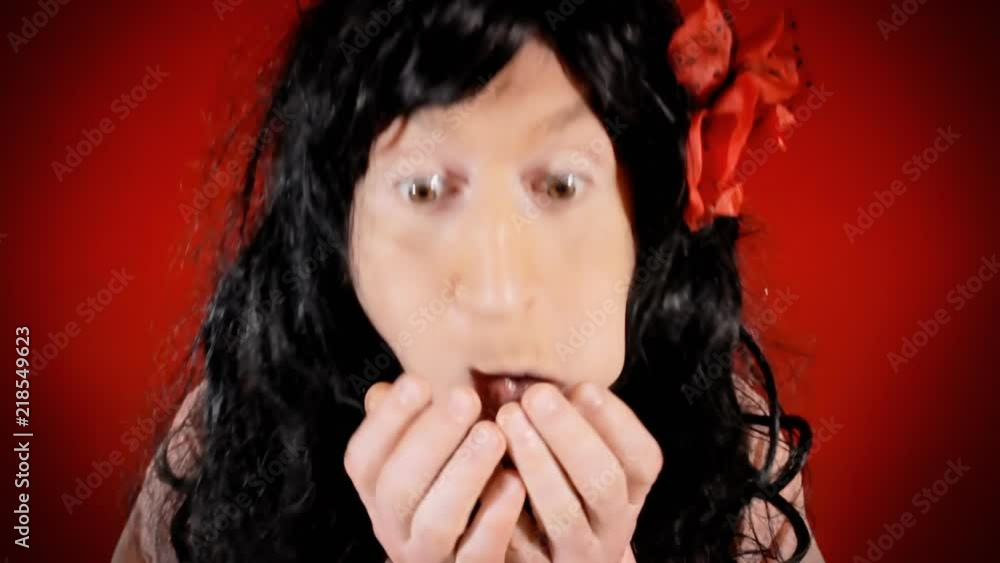 A hungry ugly man wearing a woman's wig, eating a sweet snack. Funny