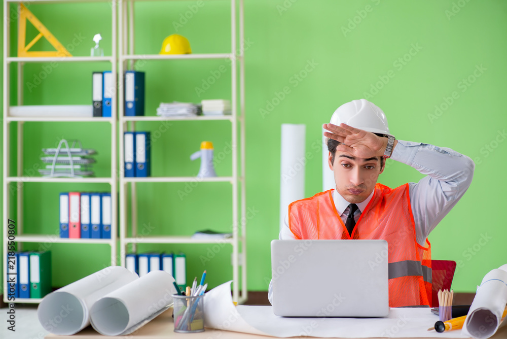 Man architect working on the project Man architect working on the project