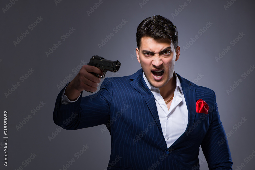 Handsome man against gray background Handsome man against gray background