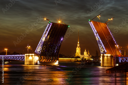 Defocused city landscape of raised Palace bridge above river Neva.  White night in Saint-Petersburg  Russia.