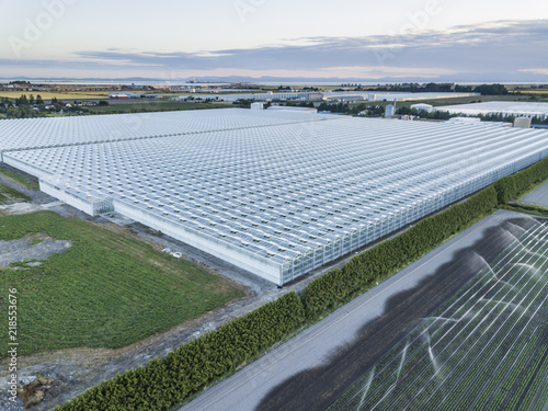 Huge Greenhouses on Farm Land photo