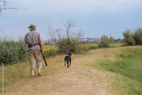 Hunter with a German trotter and spaniel, hunting a pheasant with dogs  © Mountains Hunter