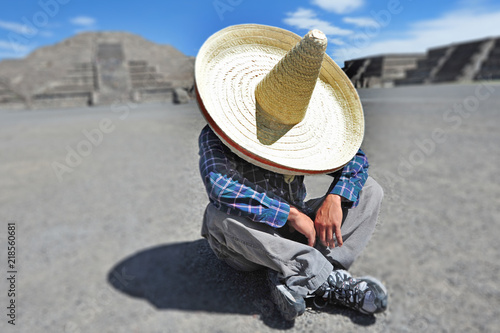 Man wearing Sombrero hat having a siesta/nap in Mexico photo