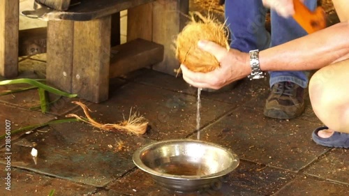 Opening a coconut photo