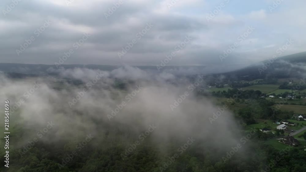 Drone flying through the mist. Close up view of low-hanging clouds