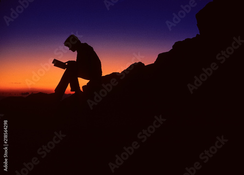 Person Reading at Sunset