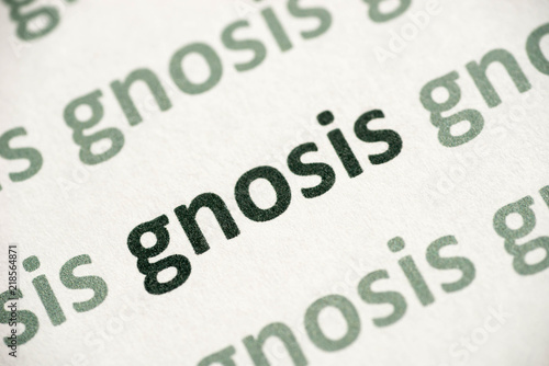 word gnosis printed on paper macro