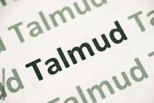 word Talmud printed on paper macro photo