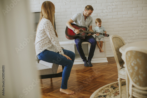 Happy family with guitar