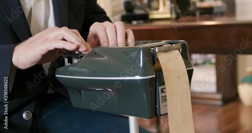 Stenographer or court reporter typing out short hand using a stenograph or steno writer machine. photo