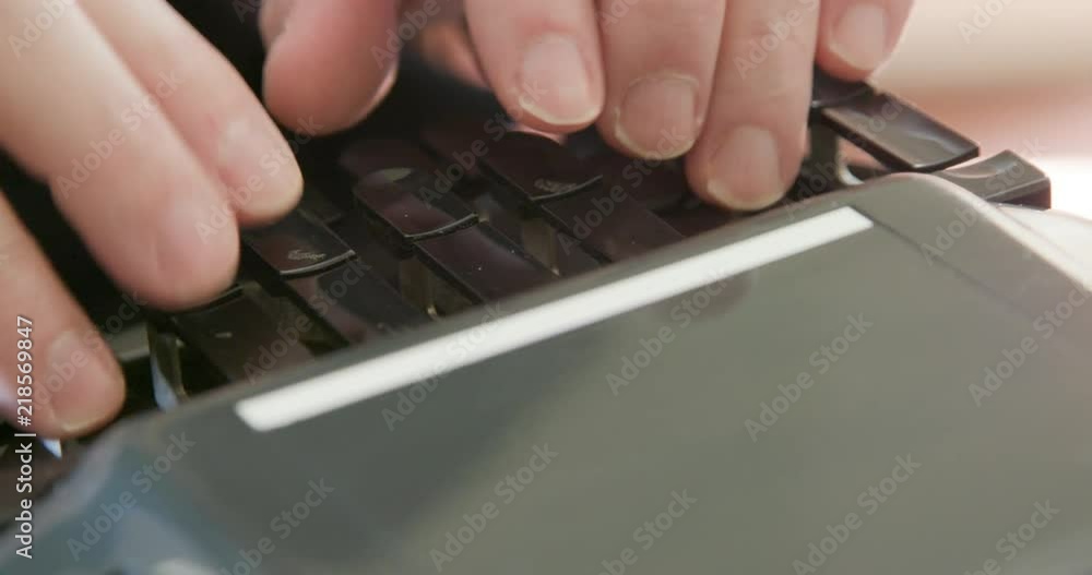 Stenographer or court reporter typing out short hand using a stenograph or steno writer machine. Stenographer or court reporter typing out short hand using a stenograph or steno writer machine.