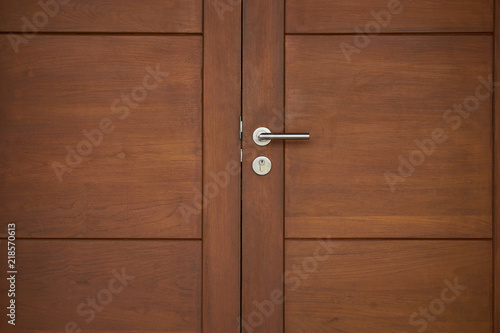 old wood door close with silver handle