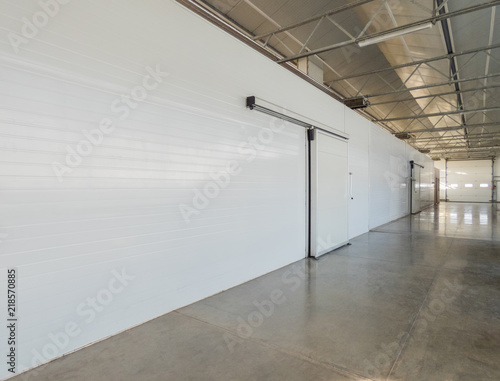 Schilderij op canvas large freezer storage in the factory. closed door from warehouse