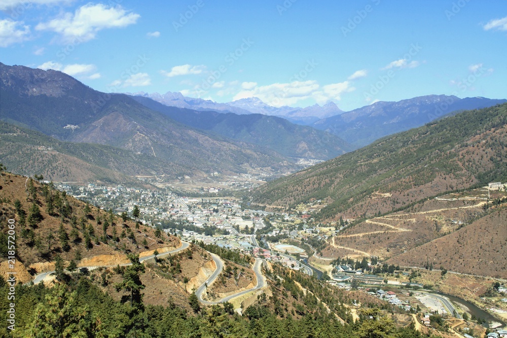 Winding or curved asphalt road on the hill with view of Thimphu city,  Bhutan