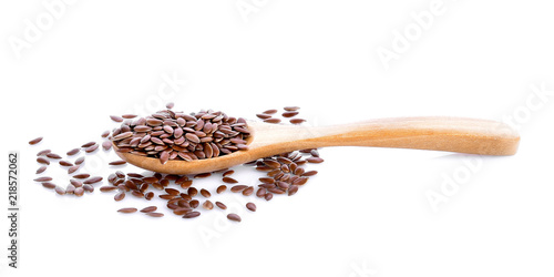 Flax seeds in wood on white background