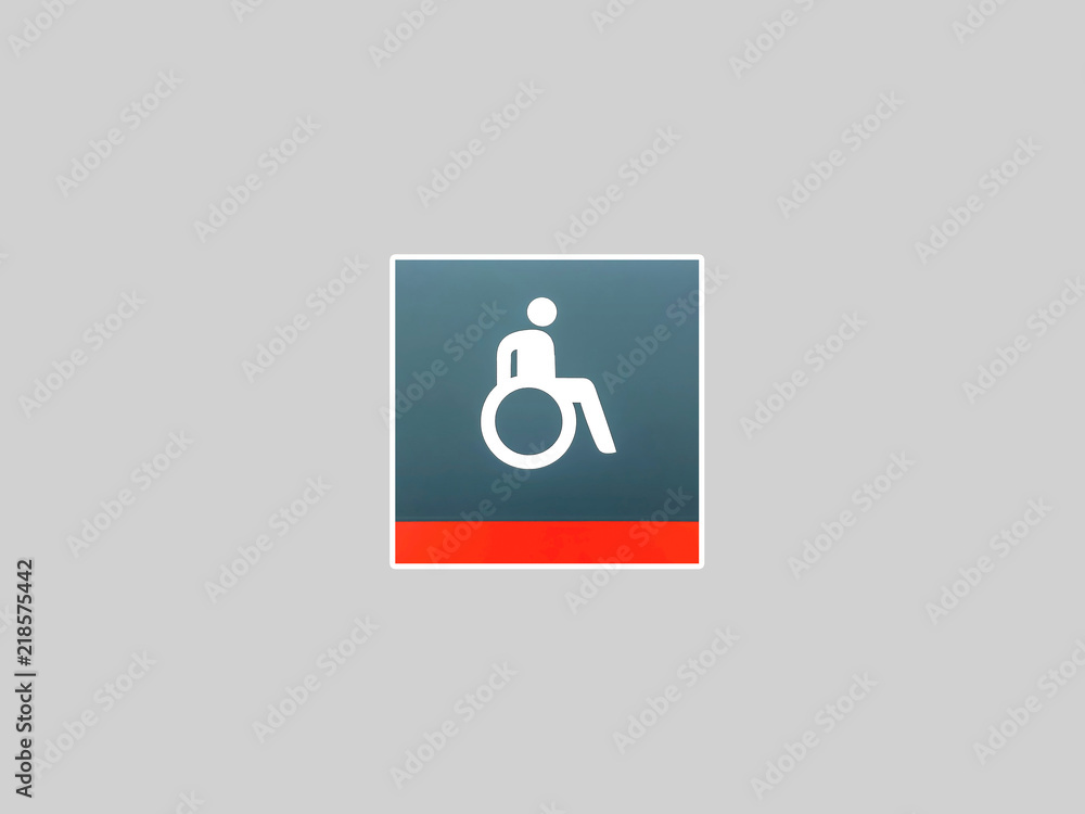 Handicapped sign, detail of an information signal, handicapped sign on a gray background Handicapped sign, detail of an information signal, handicapped sign on a gray background