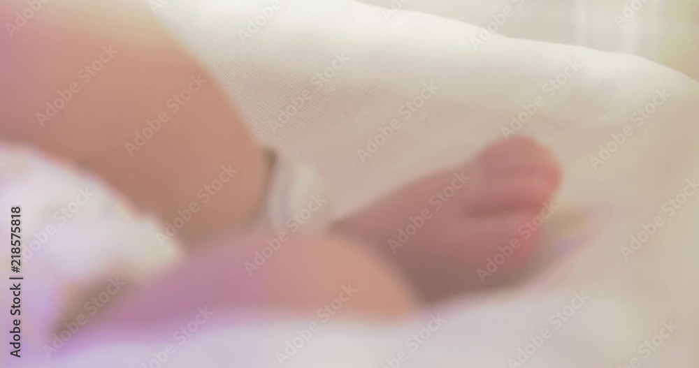 Small leg. A newborn baby in the hospital. Small child.Panning, Small leg. A newborn baby in the hospital. Small child.Panning,