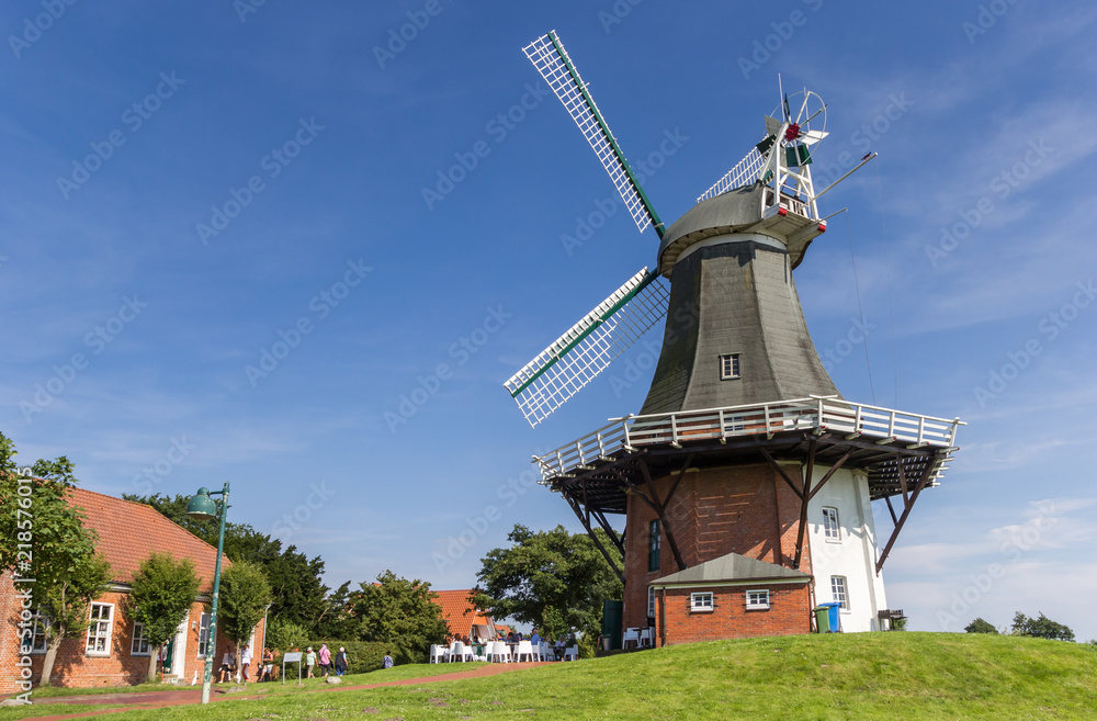 Windmills in the historic center of Greetsiel, Germany