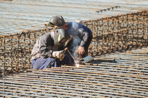 Wallpaper Mural Welder works on welding of basement metall carcass Torontodigital.ca