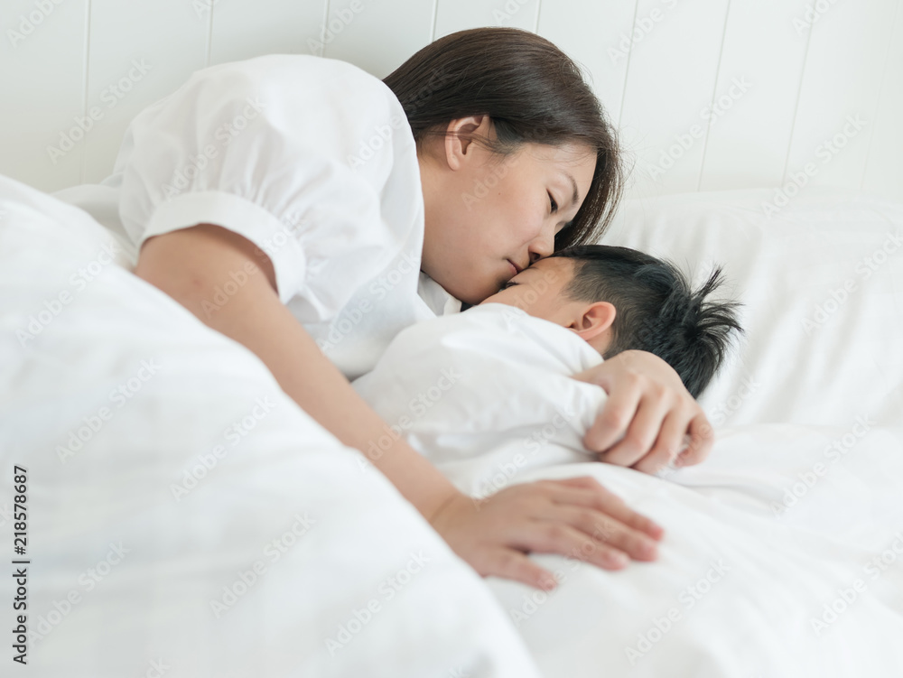 1000px x 751px - Beautiful asian mother giving good night kiss to her sleeping son in bed at  home. Lovely mother putting son to the bed. Happy family concept. Stock  Photo | Adobe Stock