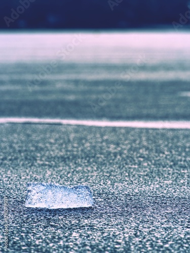 Broken floes and  iceberg. A large ice piece on freshwater ice that has broken off