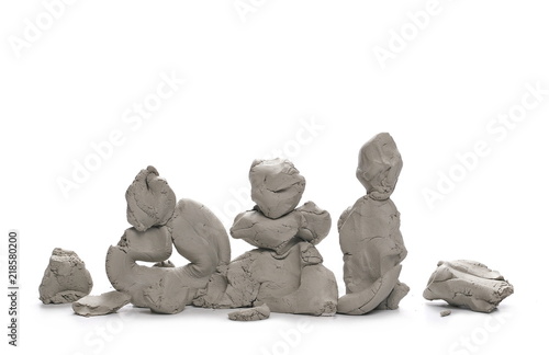 Grey modelling clay blocks, pieces isolated on white background