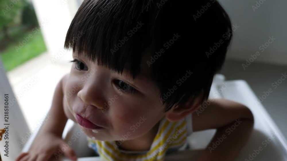 cute child happy eating time, close-up face cute child happy eating time, close-up face