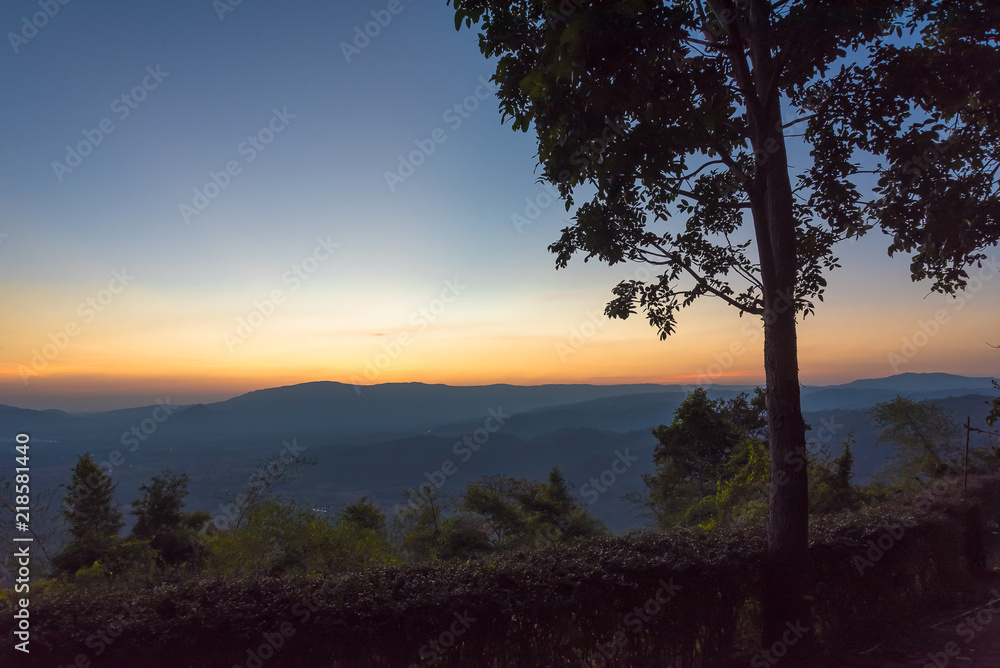 Scenic view of sunrise mountains at northeast Thailand, Mountain range for climbing in mountain trails. the landscape of mountain which including of copy-space for texting. 
