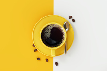 Top view of coffee cup on yellow and white background.