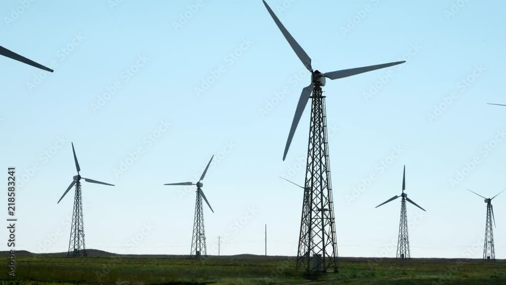 Many old wind turbine generators on green grass. Built in the Soviet Union. Many old wind turbine generators on green grass. Built in the Soviet Union.