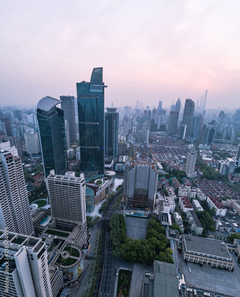 Aerial View of business area and cityscape in foggy dawn, West Nanjing road, Jing`an district, Shanghai